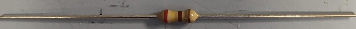 Through-hole carbon film resistor with color-band markings — standard PCB component