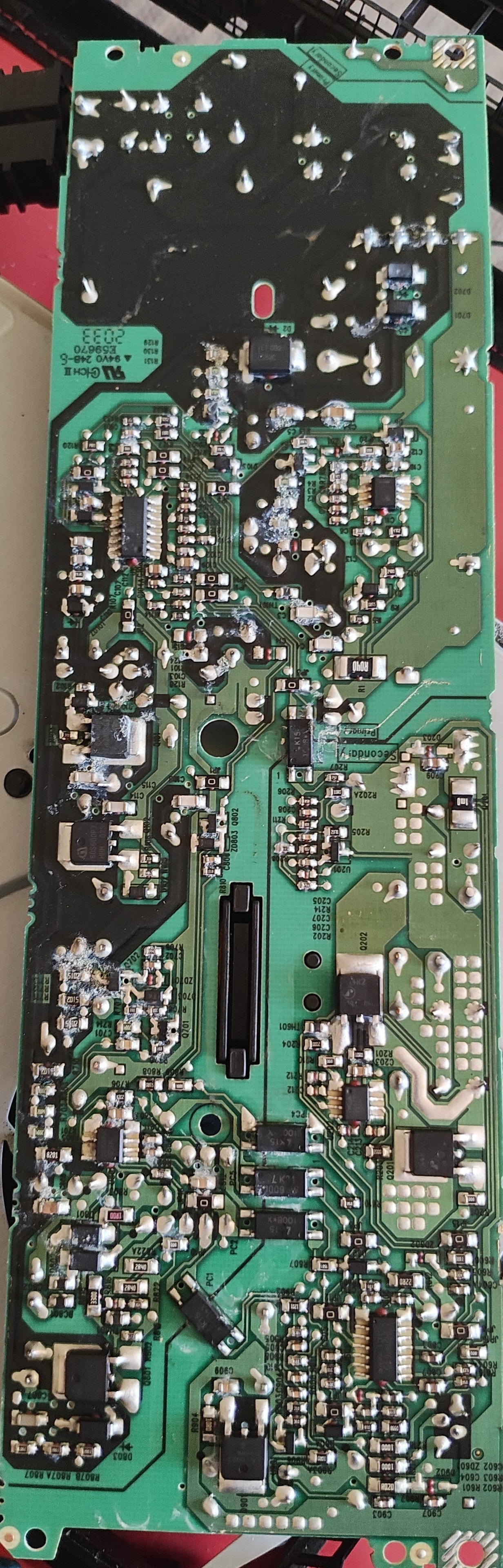Full circuit board assembly showing SMD components, ICs, and solder points